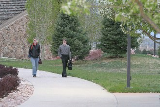 Students walking around Apostles Court on their way to class.