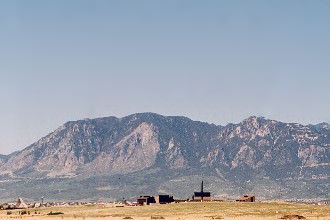 This is an old photo of Cheyenne Mountain and NORAD with the Nazarene Bible College in the foreground.