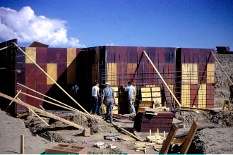 Forms being placed for the basement concrete walls.