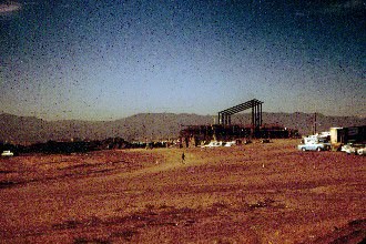 The skeleton of the top of the administration building is being built in this shot.