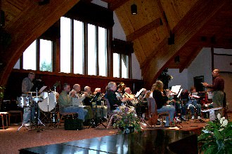 Here, Dr. Grimo is working with students of all ages just before a concert.