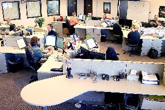 Candid shot of some hard working folks in the online department.