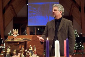 Chaplain Alan Lyke preaching during Christmas in Strickland Chapel.